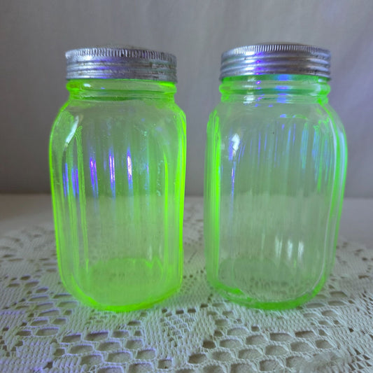 Vintage green uranium Glass Salt Pepper Shakers UV Glow Ribbed metal lids