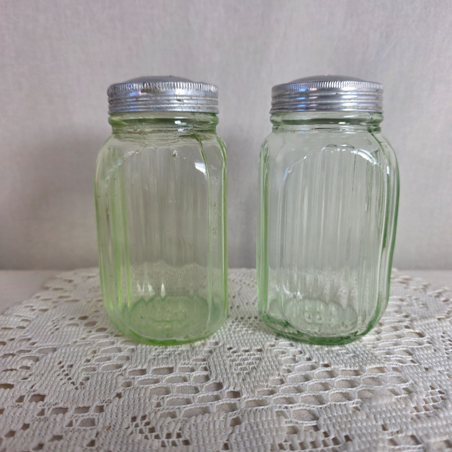 Vintage green uranium Glass Salt Pepper Shakers UV Glow Ribbed metal lids