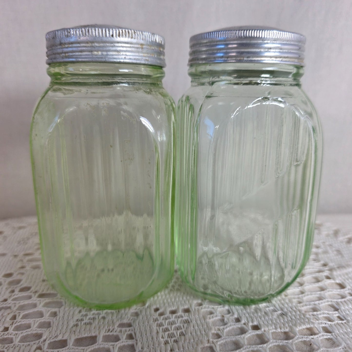 Vintage green uranium Glass Salt Pepper Shakers UV Glow Ribbed metal lids