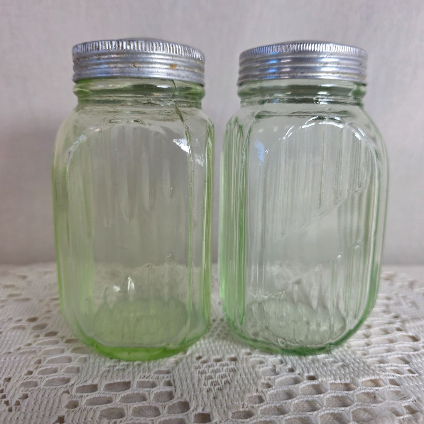 Vintage green uranium Glass Salt Pepper Shakers UV Glow Ribbed metal lids