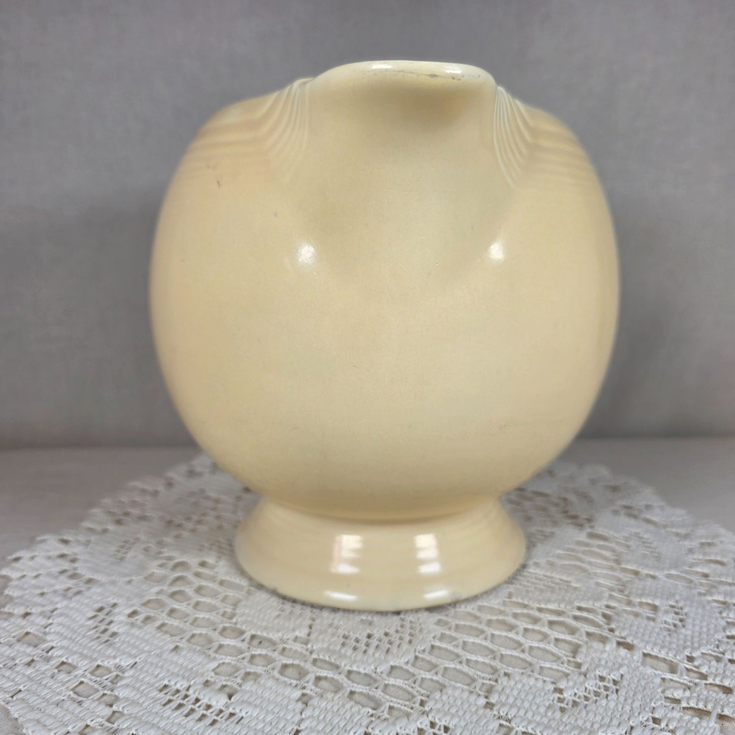 Vintage Fiesta Ivory Ice Lip Pitcher 9 1/2" Wide 7" Tall With Minor Chips On Base Edge