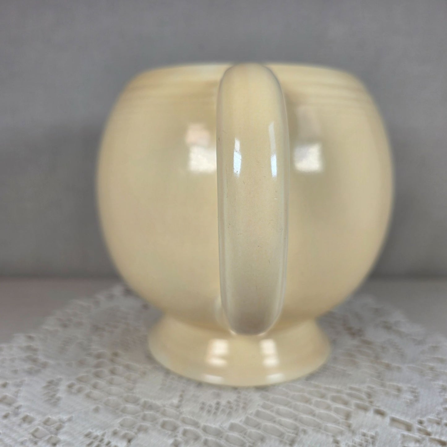 Vintage Fiesta Ivory Ice Lip Pitcher 9 1/2" Wide 7" Tall With Minor Chips On Base Edge